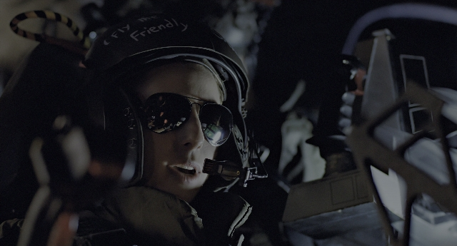 Wide shot frame from Aliens — hat, night, face