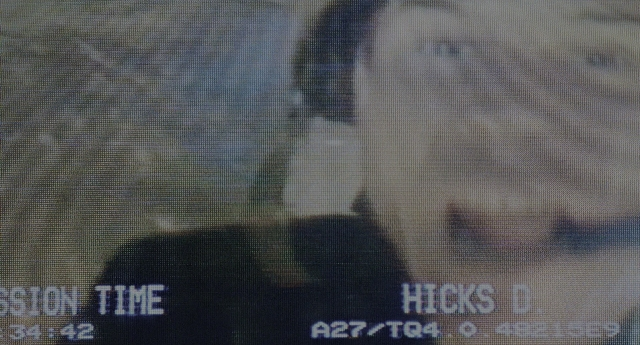 Wide shot frame from Aliens — room, hand, shirt