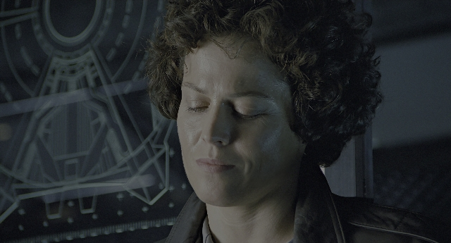 Wide shot frame from Aliens — standing, face, hair