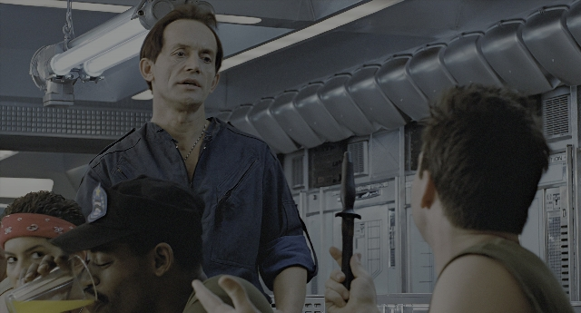 Wide shot frame from Aliens — standing, room, dialogue