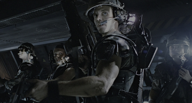 Wide shot frame from Aliens — room, hat, night