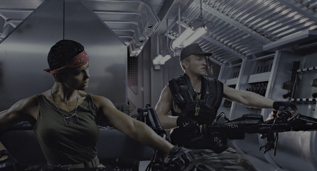 Wide shot frame from Aliens — sitting, room, dialogue