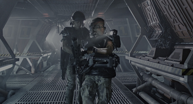 Wide shot frame from Aliens — uniform, gun, person