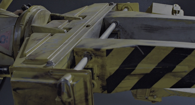Wide shot frame from Aliens — car, gun