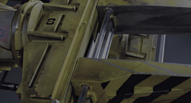Wide shot frame from Aliens — gun, land vehicle