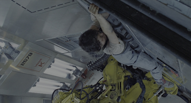 Wide shot frame from Aliens — standing, hand, shirt
