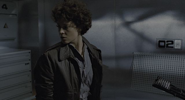 Wide shot frame from Aliens — standing, room, jacket