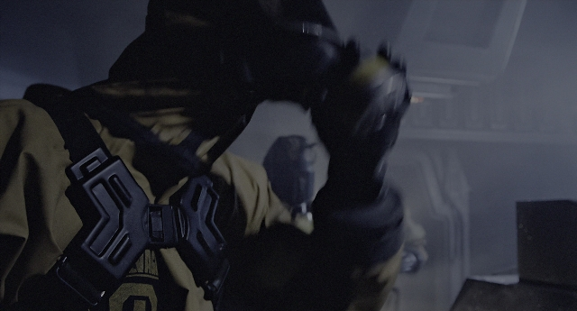 Wide shot frame from Aliens — standing, plate, room