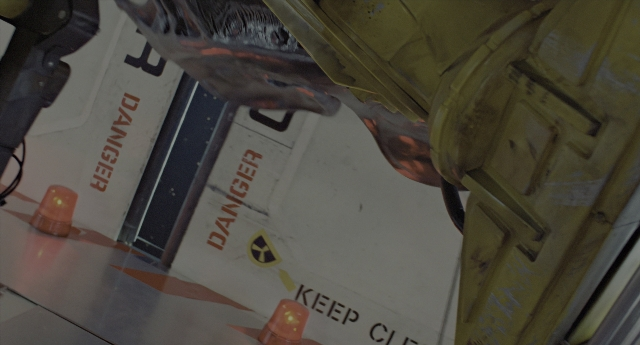 Wide shot frame from Aliens — room, door, hat