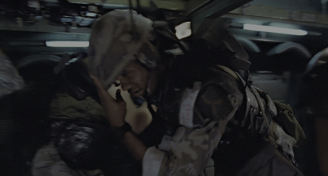 Wide shot frame from Aliens — room, dialogue, phone