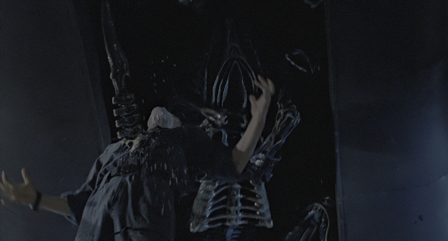 Wide shot frame from Aliens — standing, shirt, face
