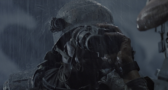 Wide shot frame from Aliens — standing, hat, gun