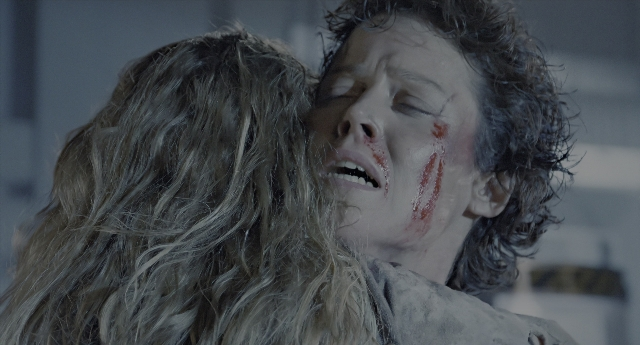 Wide shot frame from Aliens — face, hair, person