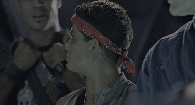 Wide shot frame from Aliens — shirt, hair, person