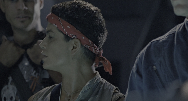 Wide shot frame from Aliens — standing, beard, face