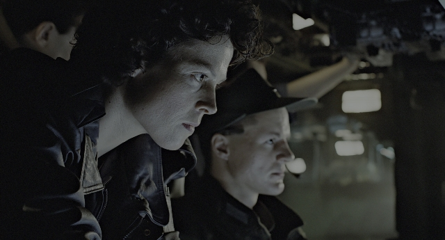 Wide shot frame from Aliens — room, hat, face