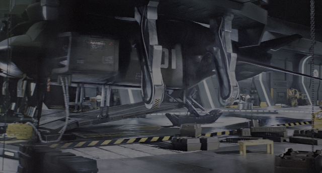 Wide shot frame from Aliens — furniture