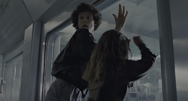 Wide shot frame from Aliens — standing, hair, person