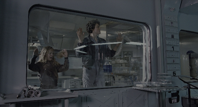 Wide shot frame from Aliens — standing, room, mirror