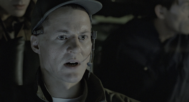 Close-up frame from Aliens — dialogue, hat, face