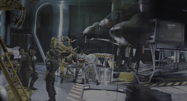 Wide shot frame from Aliens — airplane, person