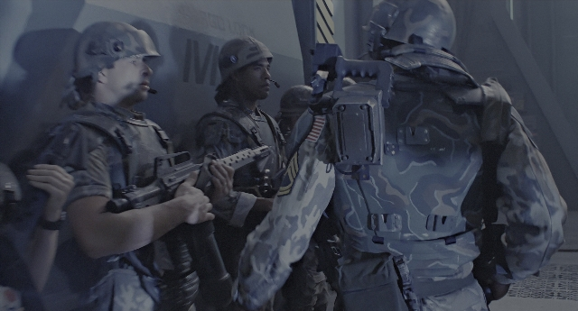 Wide shot frame from Aliens — standing, room, dialogue