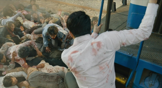 Wide shot frame from Busanhaeng — shirt, bus, person