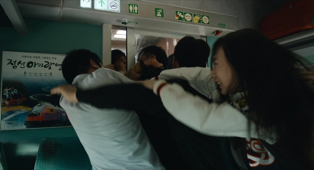 Wide shot frame from Busanhaeng — door, shirt, hair