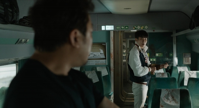 Wide shot frame from Busanhaeng — standing, car, bag