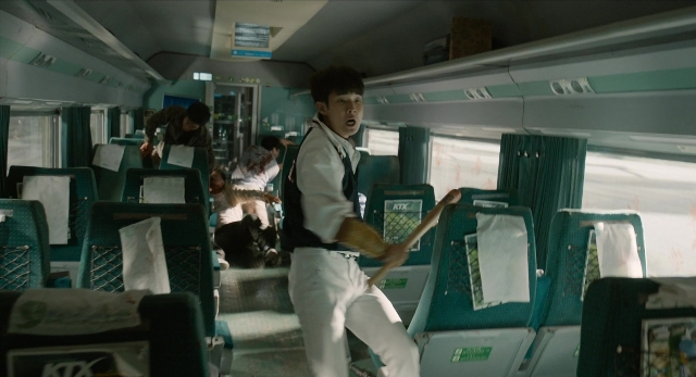 Wide shot frame from Busanhaeng — car, shirt, train