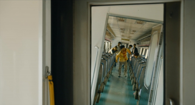 Wide shot frame from Busanhaeng — walking, door, car