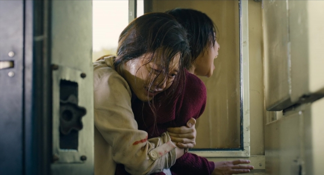 Wide shot frame from Busanhaeng — room, hug, hair