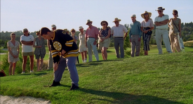 Wide shot frame from Happy Gilmore — standing, shirt, person