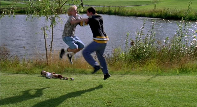 Wide shot frame from Happy Gilmore — shirt, person, footwear