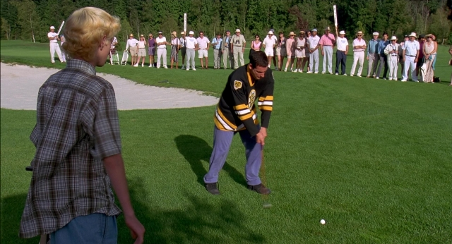 Wide shot frame from Happy Gilmore — standing, hand, shirt