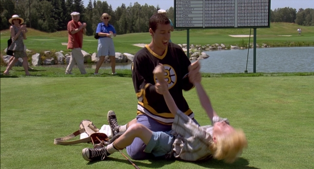Wide shot frame from Happy Gilmore — sitting, hand, face