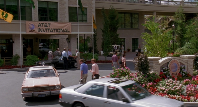Wide shot frame from Happy Gilmore — walking, bed, street