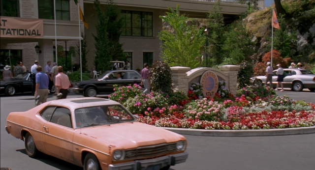 Wide shot frame from Happy Gilmore — walking, street, car