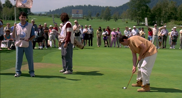 Wide shot frame from Happy Gilmore — sitting, standing, person