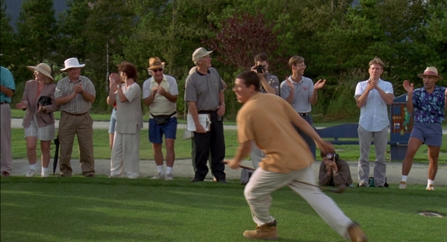 Close-up frame from Happy Gilmore — standing, shirt, person