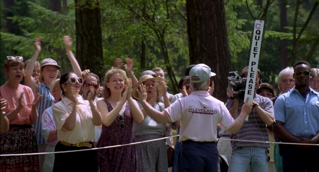 Wide shot frame from Happy Gilmore — standing, person, human face