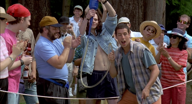 Wide shot frame from Happy Gilmore — standing, hand, water