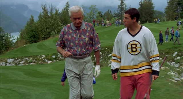 Wide shot frame from Happy Gilmore — walking, hand, shirt