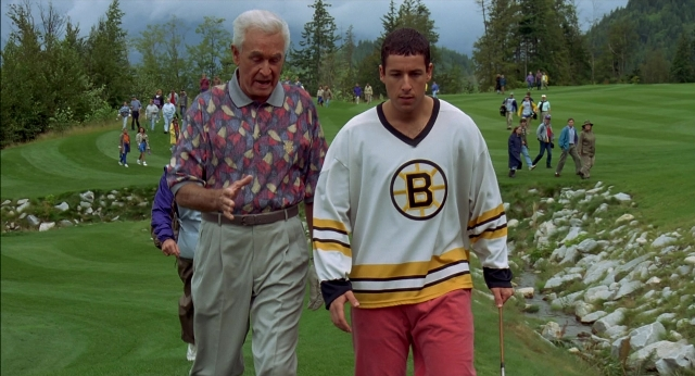 Wide shot frame from Happy Gilmore — walking, hand, shirt