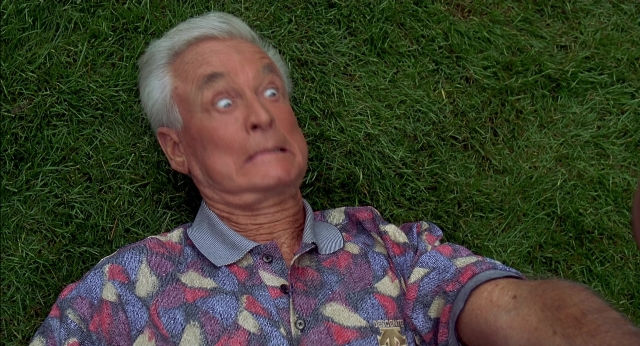 Wide shot frame from Happy Gilmore — hand, shirt, face