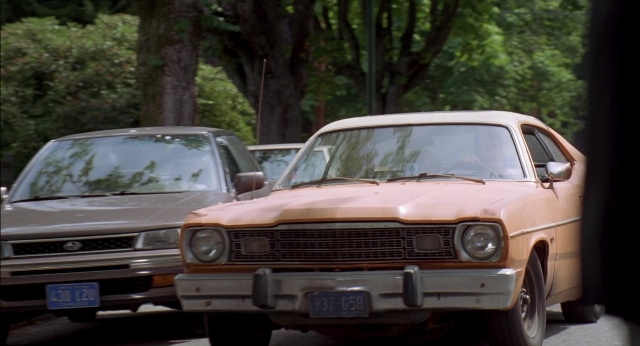 Wide shot frame from Happy Gilmore — plate, street, car