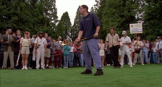 Wide shot frame from Happy Gilmore — standing, hat, shirt