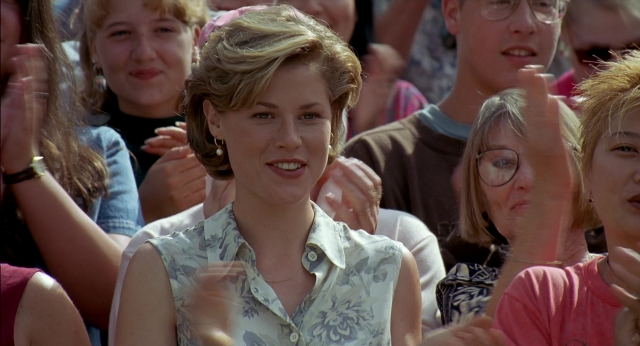 Medium shot frame from Happy Gilmore — standing, hair, person