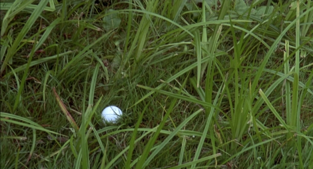 Wide shot frame from Happy Gilmore — golf ball
