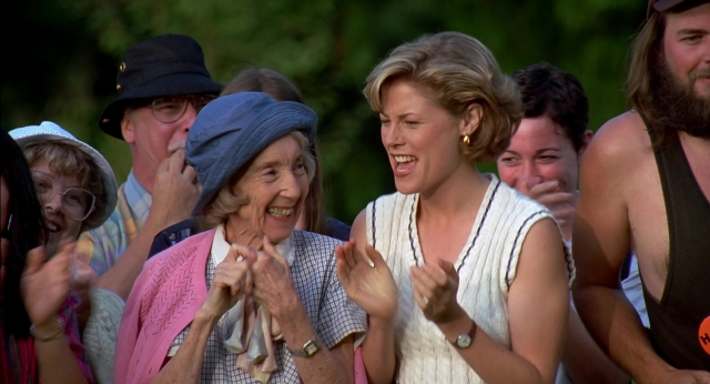 Wide shot frame from Happy Gilmore — hat, beard, mustache